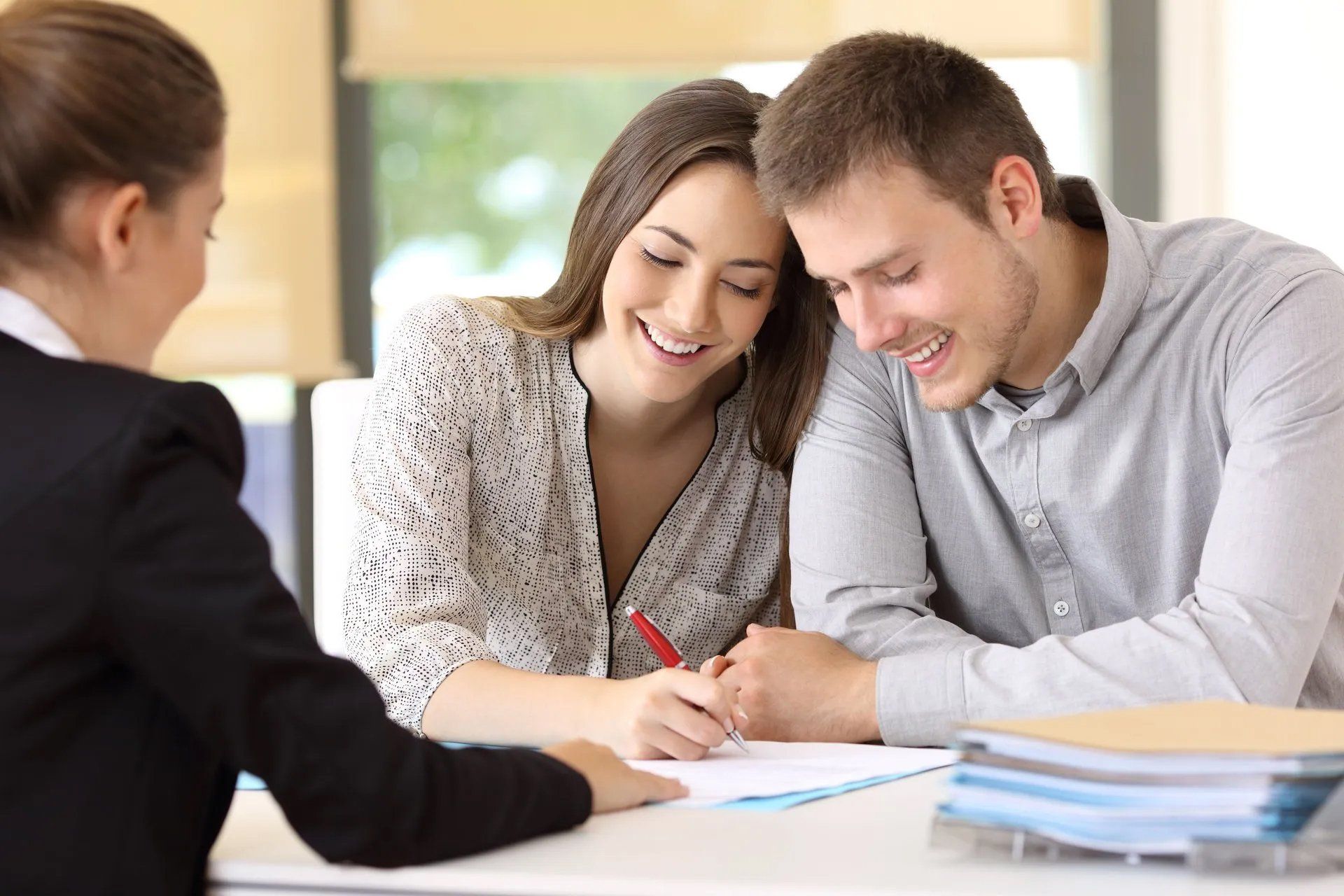 Couple meeting with a life insurance agent